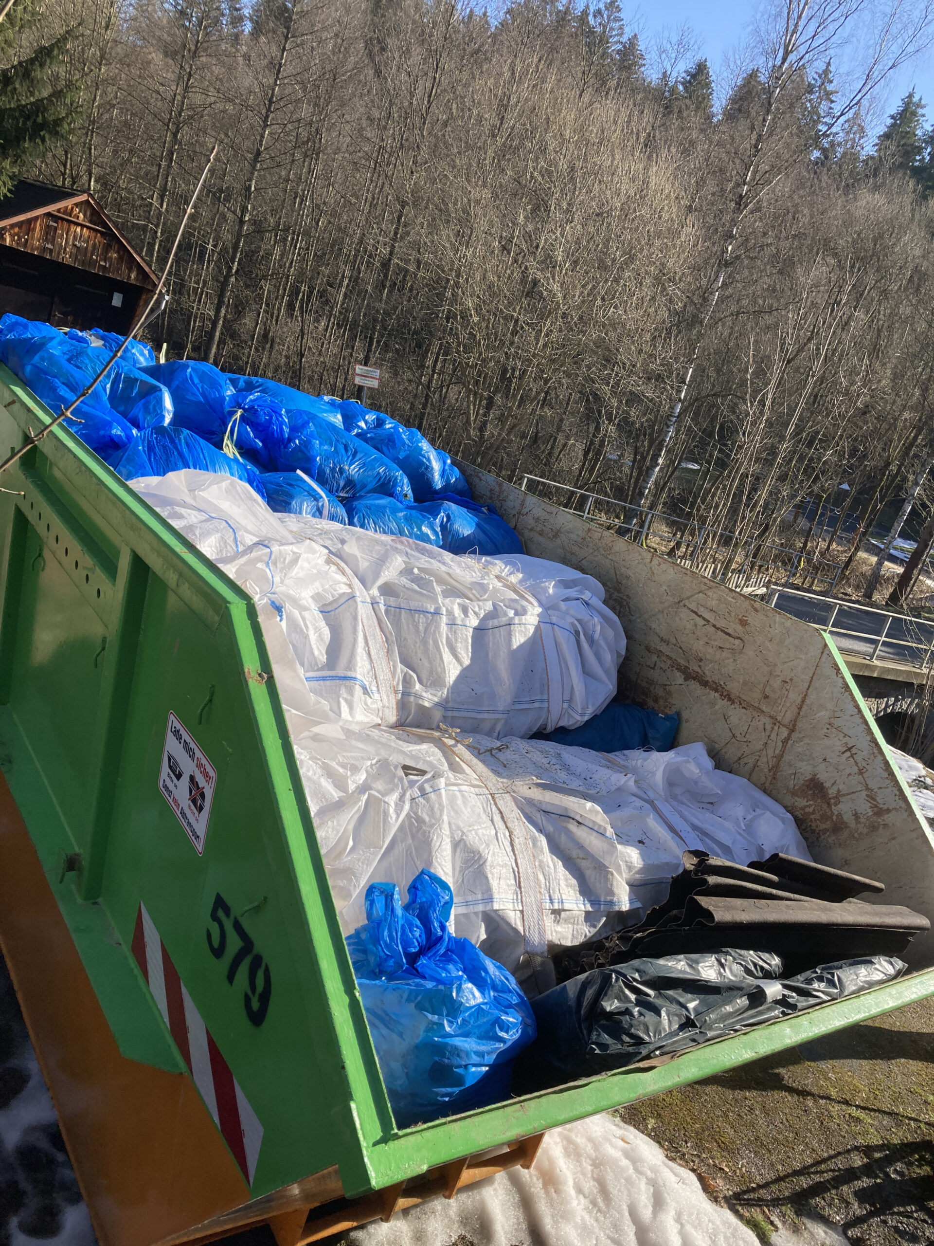 Container full of Asbestos, polystyrene and glass fibre insulation